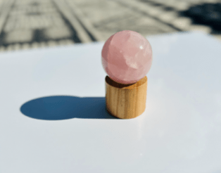 Polished Rose Quartz Sphere promotes love, compassion, and emotional healing, perfect for meditation, intention setting, or home decor
