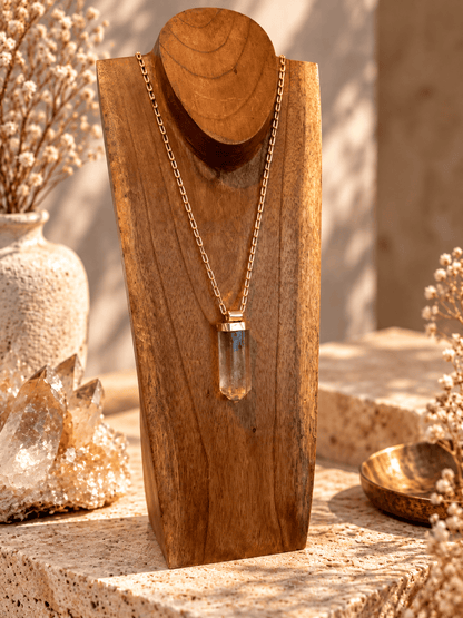 Large Smoky Quartz crystal pendant necklace on adjustable gold open-link chain displayed on wooden jewelry 