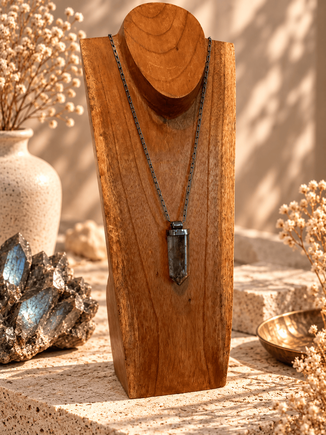 Large Smoky Quartz crystal pendant necklace on adjustable titanium open-link chain displayed on wooden jewelry 