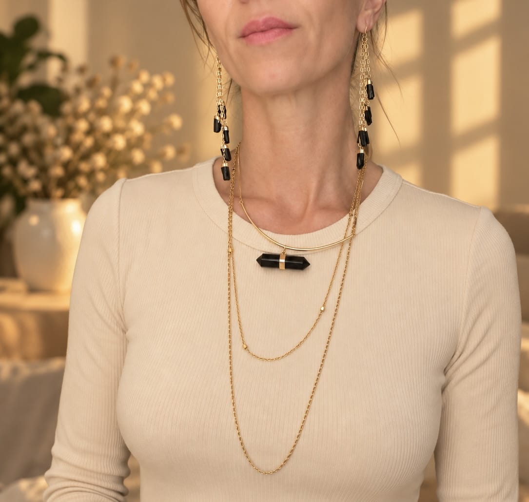 Five-stone crystal drop earrings worn with layered BellaVee crystal jewelry
