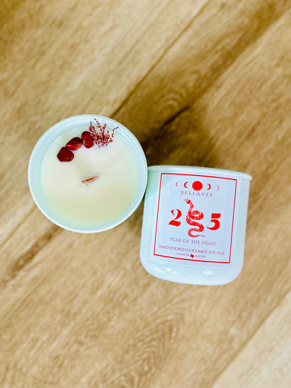 Hand-poured coconut wax Year of the Snake Candle with Red Jasper for balance and Palo Santo and Sandalwood for spiritual cleansing.
