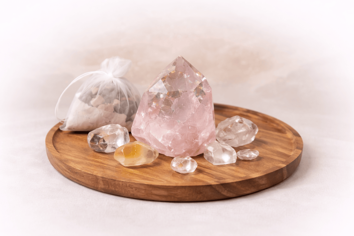 Crystal rock on a wooden tray with a white background