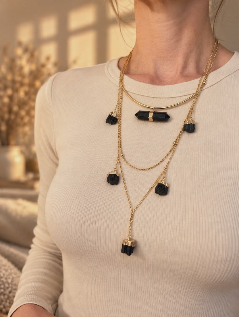 Curved bar crystal necklace worn to show the adjustable length and double-terminated crystal design