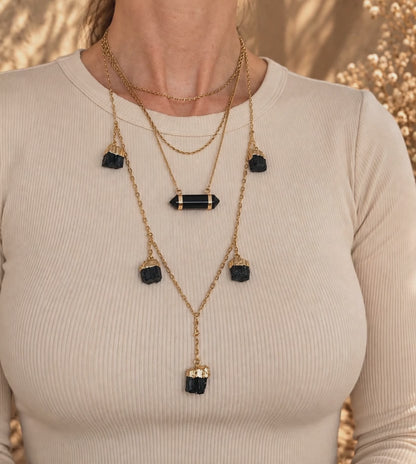 Obsidian bar necklace worn and layered showing double-terminated crystal and adjustable gold chain