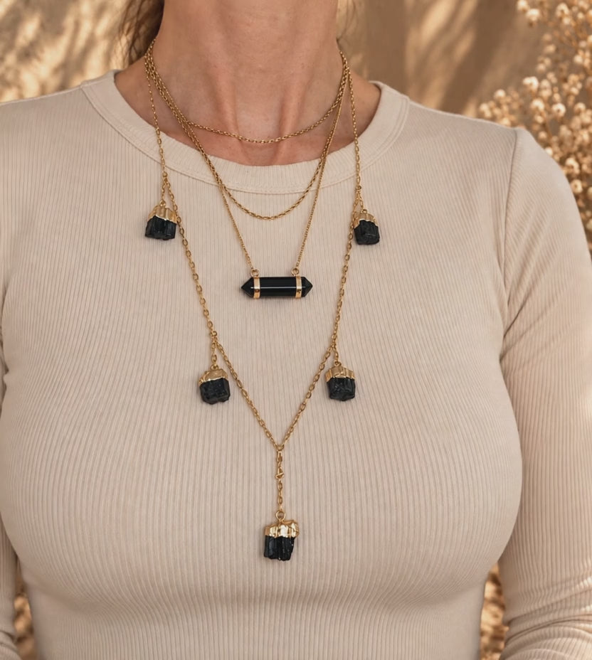 Obsidian bar necklace worn and layered showing double-terminated crystal and adjustable gold chain