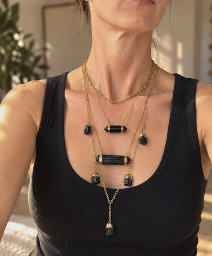 Raw Black Tourmaline bar necklace worn and styled in a layered crystal jewelry stack