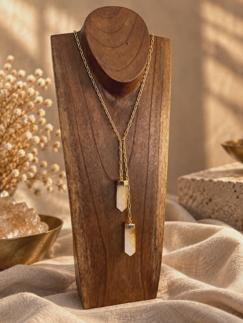 Two-stone crystal lariat necklace worn and styled in a layered crystal jewelry stack