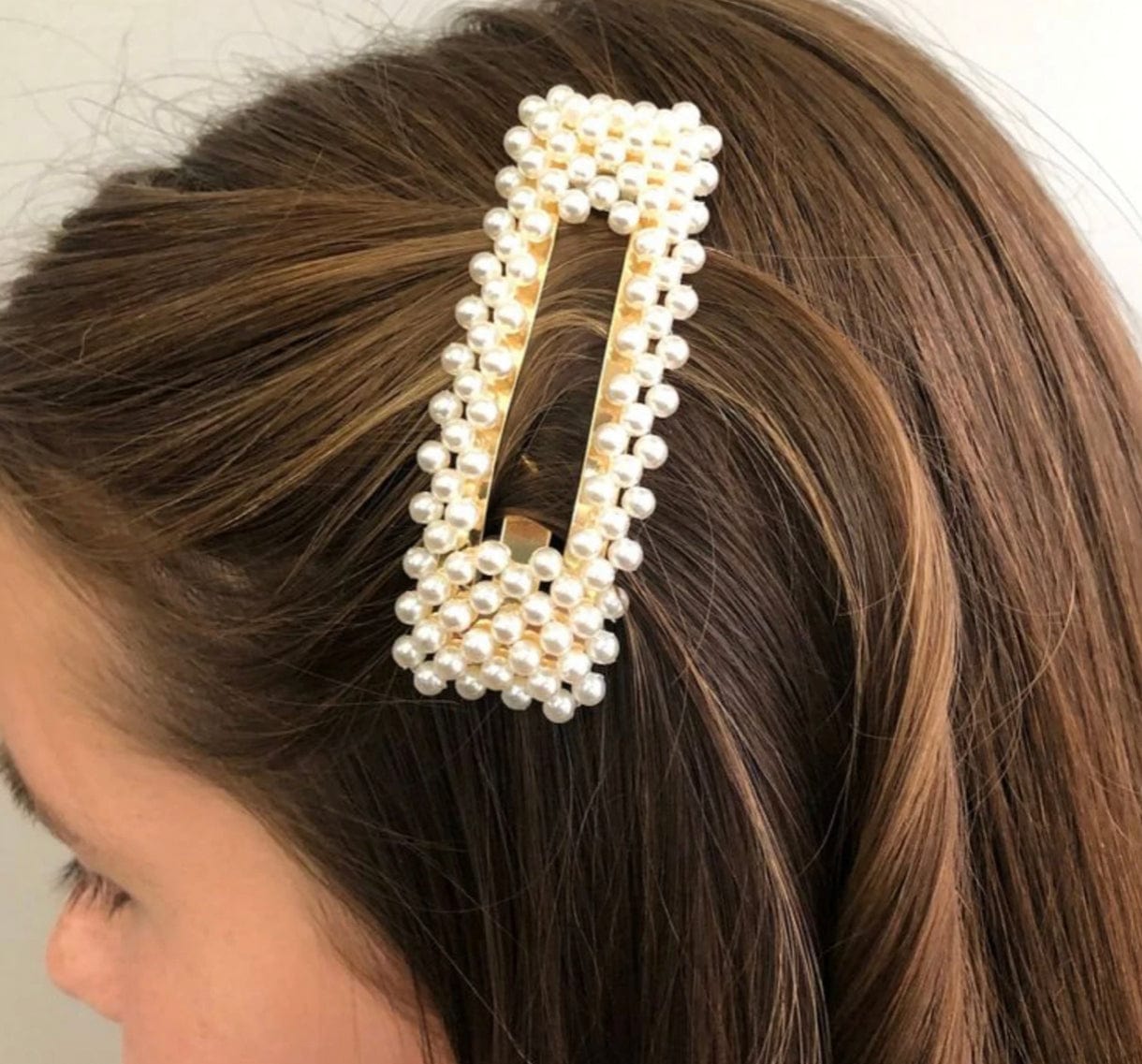 Chloe Pearl Clip in a rectangle style, offering a classic and elegant touch to complete any look
