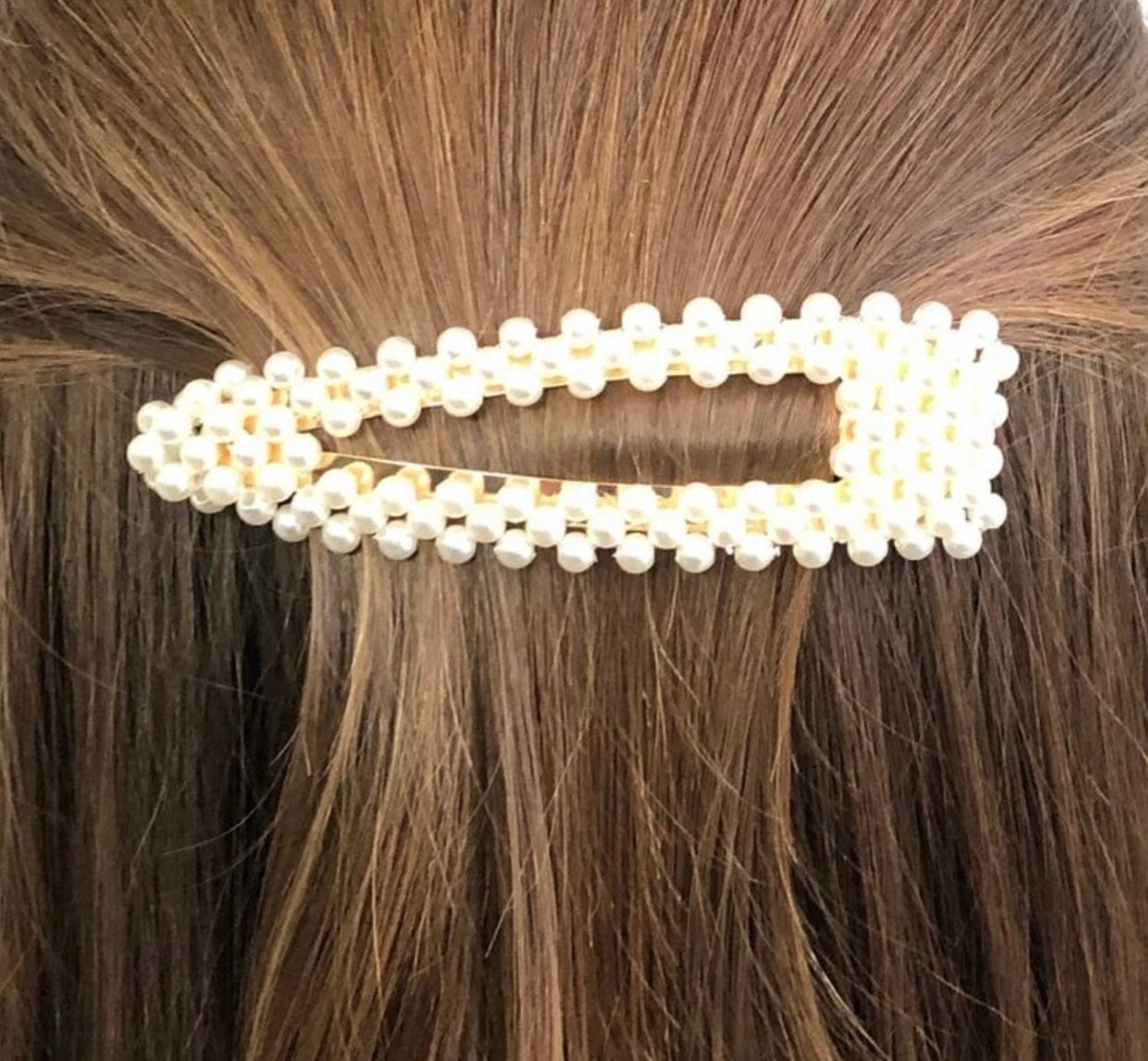 Pointed Chloe Pearl Clip with pearl accents, ideal for creating a polished and stylish finish to any look