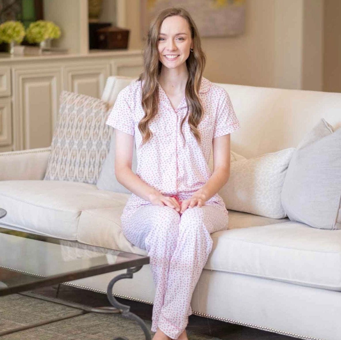 The Sweetheart Button Up drapes beautifully when worn, featuring soft fabric and delicate water-colored hearts for a charming look