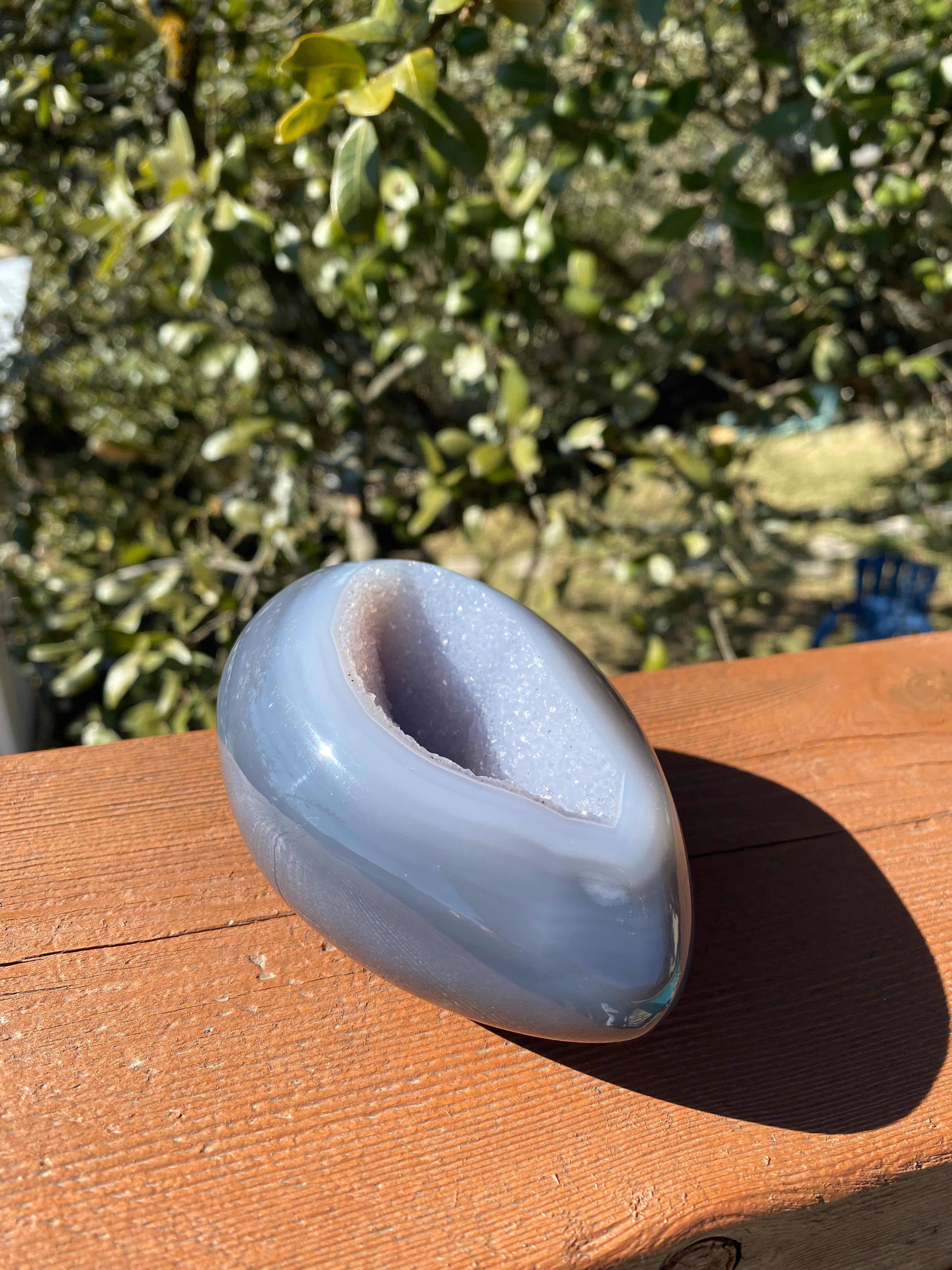 Amethyst Geode with blue Agate exterior and bright lavender crystals, perfect for enhancing decor or collections