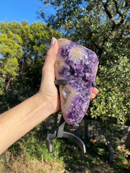 agate eyes with amethyst freeform, showcasing blue, tan, and beige banding encased in Uruguayan amethyst crystals, perfect for display