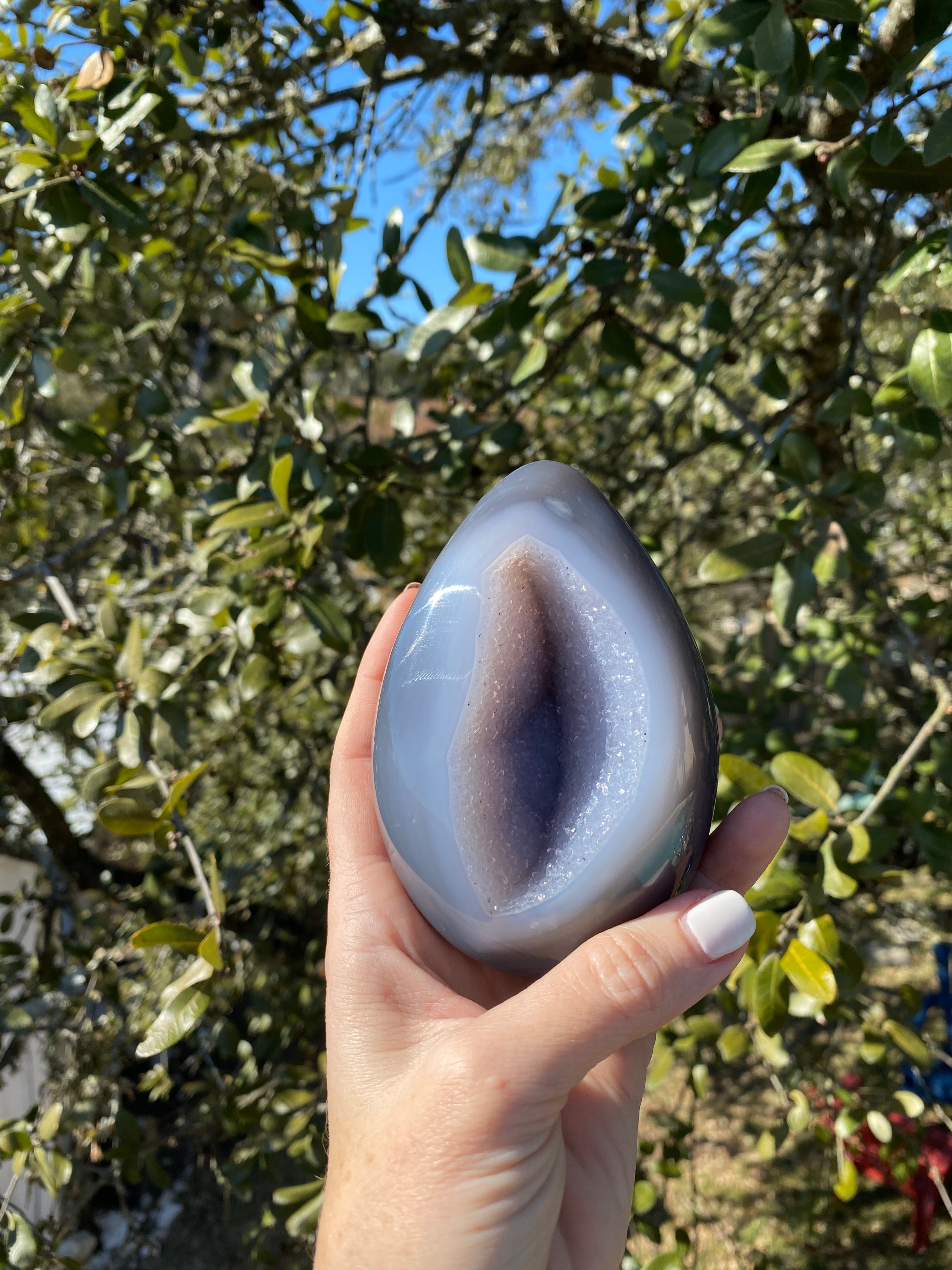 Polished Amethyst Geode with blue Agate exterior and lavender crystals, a striking statement for any interior space