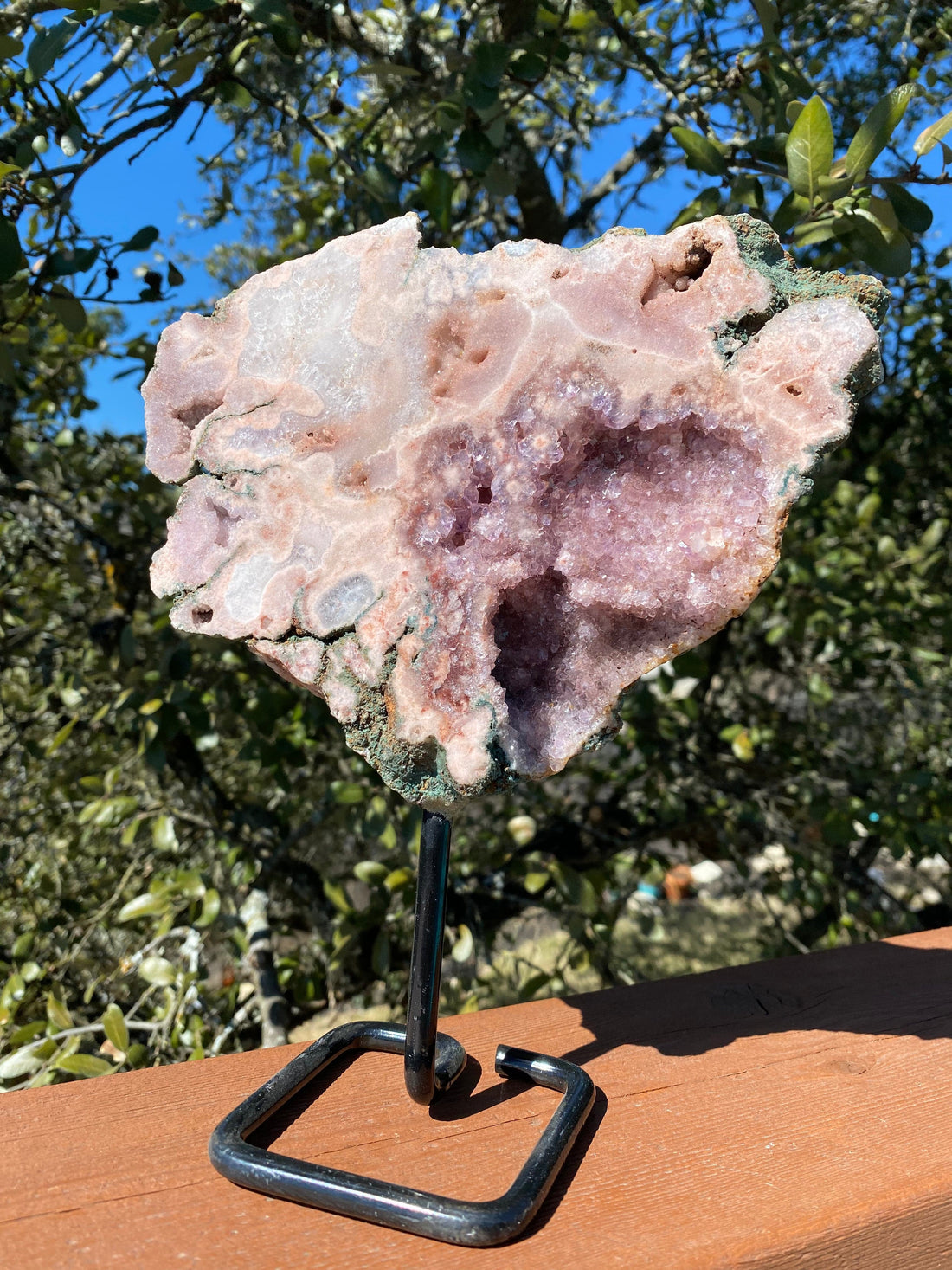 This Rose Amethyst Freeform features quartz-filled geode cavities, with natural back and built-in stand, perfect for display