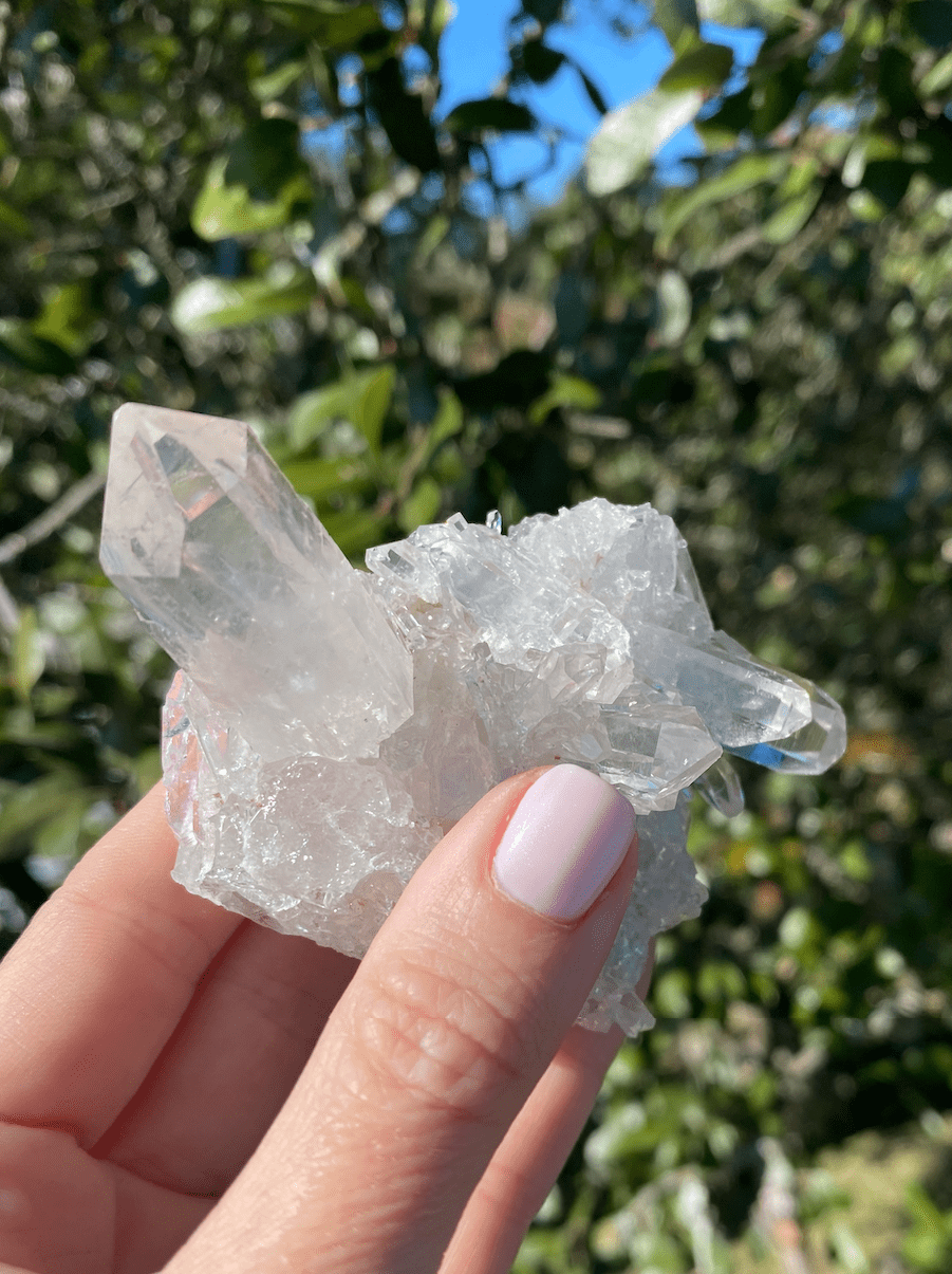 Clear Quartz Cluster with crystals growing in different directions, known for amplifying energy and filling spaces with positivity