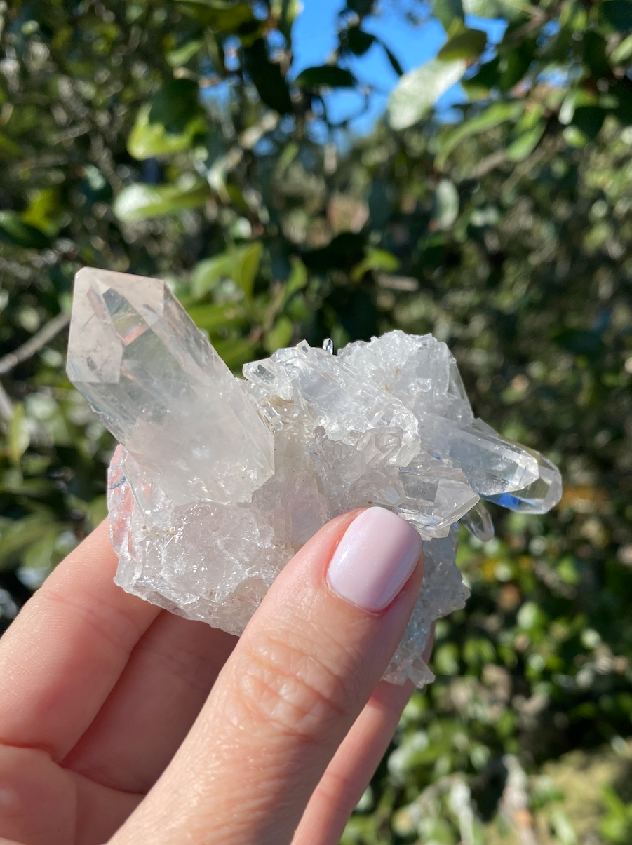 Clear Quartz Cluster with crystals growing in different directions, known for amplifying energy and filling spaces with positivity