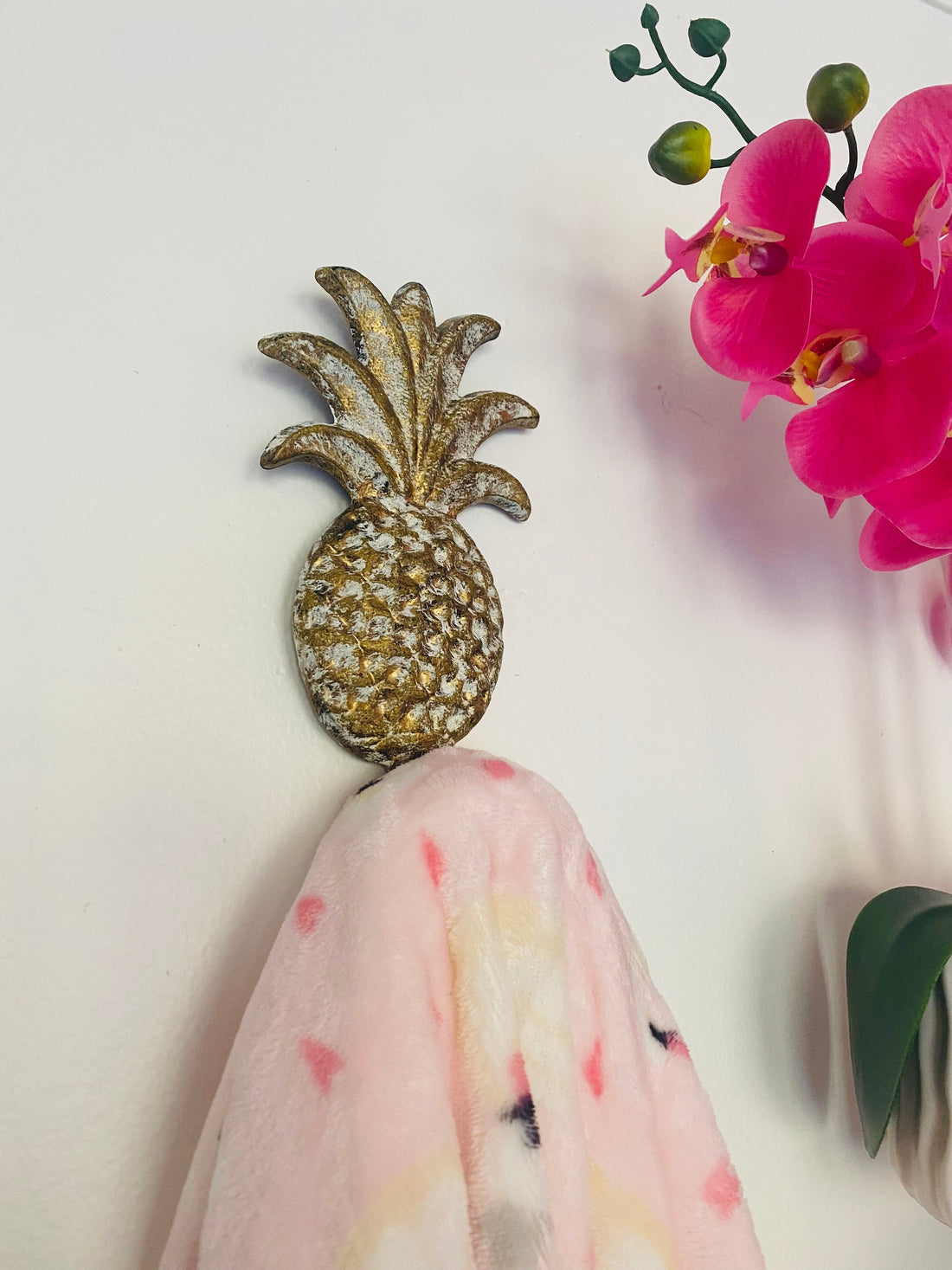 Add a touch of boho charm to your home with this gold-finish Pineapple Wall Hook. Functional and fun, it makes a great gift for any occasion