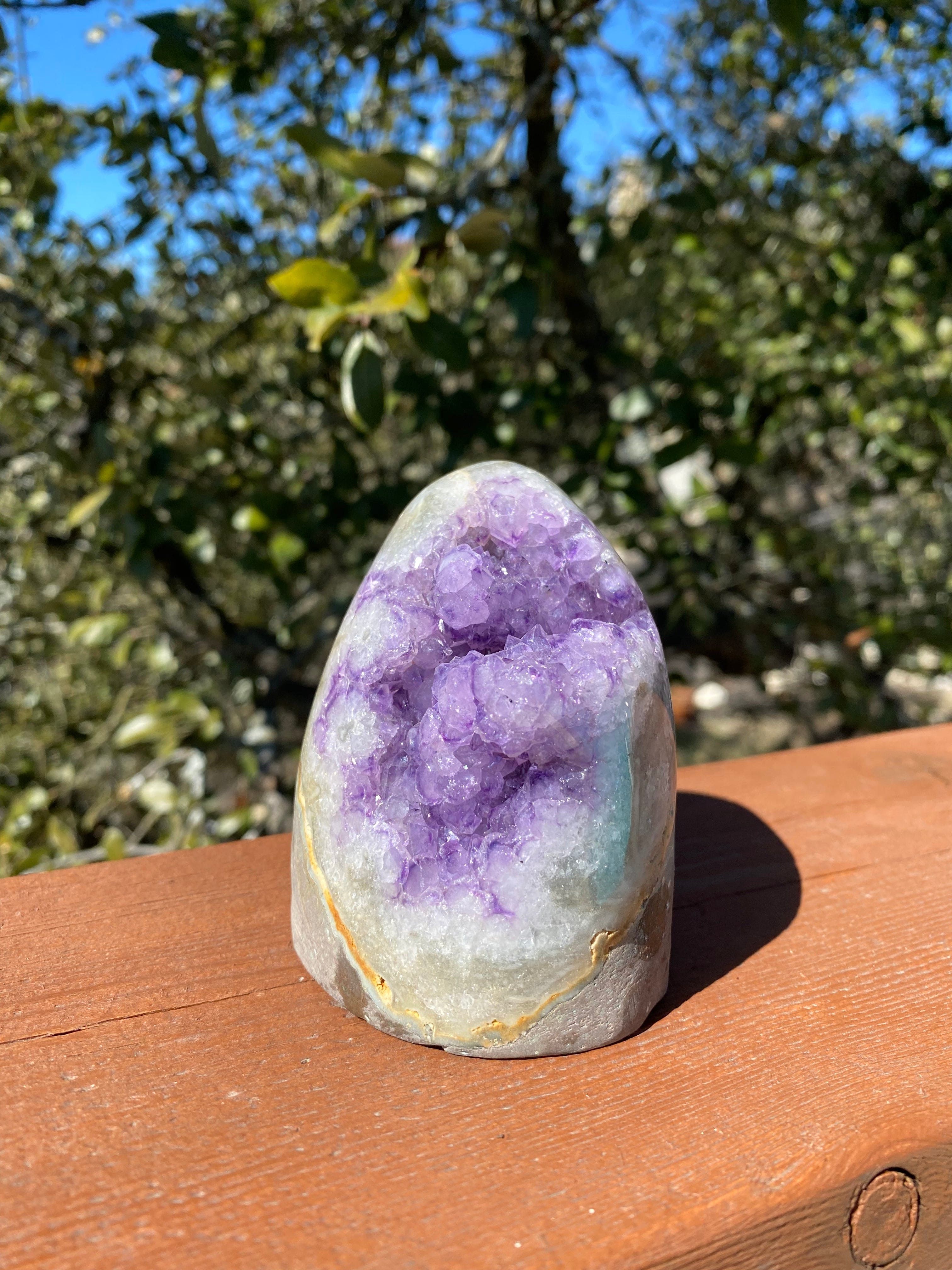 Amethyst geode freeform with Quartz crystals and vibrant Agate banding in orange and green tones, featuring polished edges.