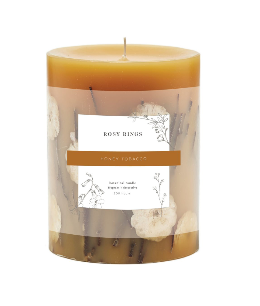 Hand-poured Honey Tobacco Round Botanical Candle with rich fragrance notes of sandalwood, patchouli, honey, and tobacco, beautifully illuminated