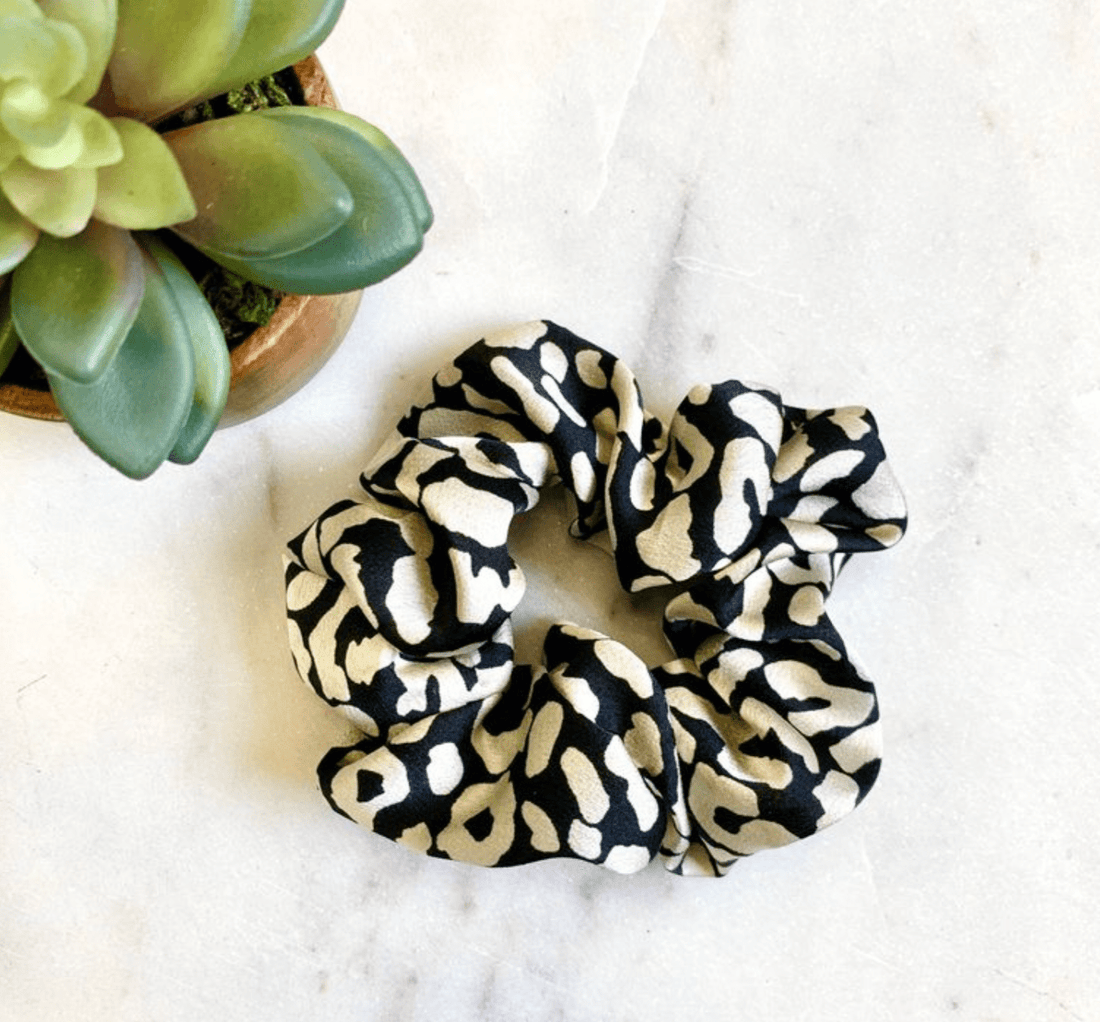 Ivory Kerri Scrunchie, with a versatile and elegant pattern, ideal for effortlessly transitioning your style from day to night