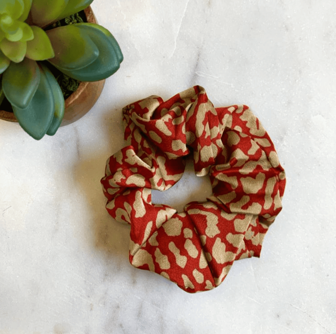 Spice Kerri Scrunchie, featuring a fun and unique pattern, perfect for adding a bold touch to your look from day to night