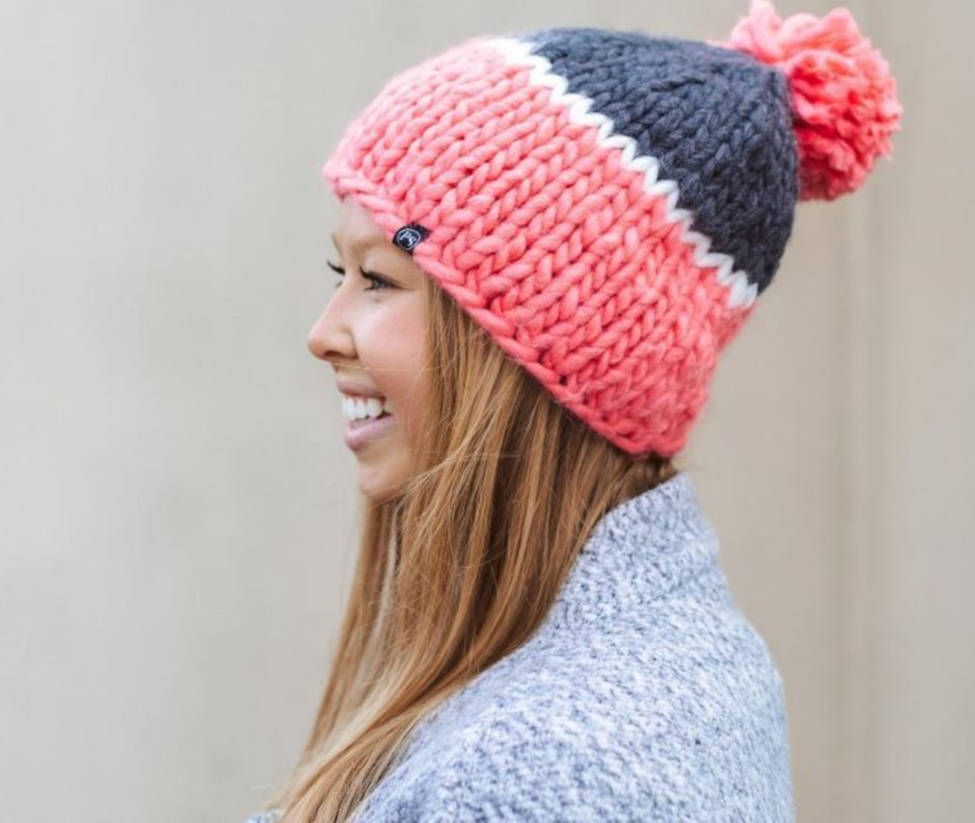 Slouchy Carly Cozy Beanie with faux fur pom-pom, made from super soft chunky knit fabric for a stylish winter look