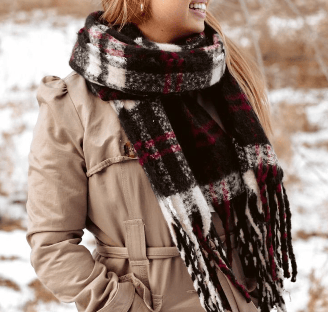 Elegant Black Lizzy Scarf with fringe, ideal for bundling up in style or gifting to someone special during colder months