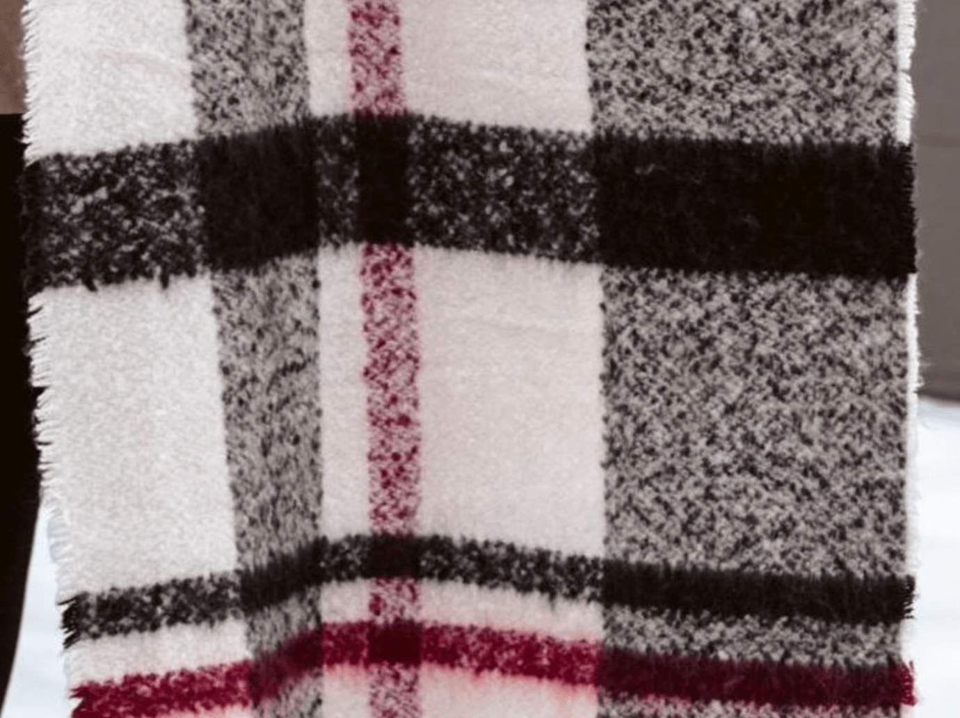 Wrap yourself in the soft Cream Lizzy Scarf, a chic addition to your winter wardrobe and a thoughtful gift for friends