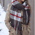 Allyn Oxford Scarf with a classic grey plaid pattern and fringe finish, versatile as a shawl or scarf.