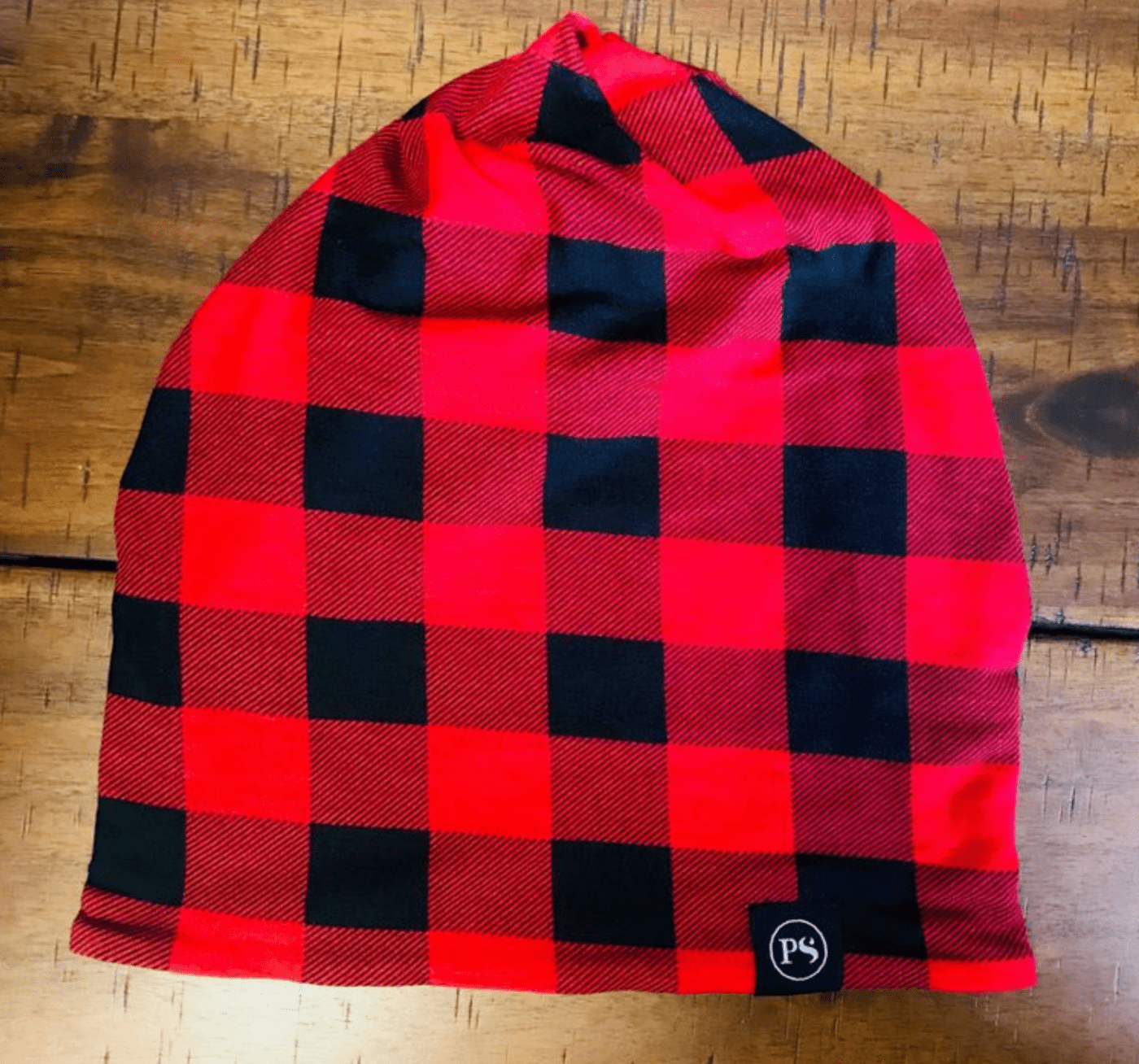 Versatile Buffalo Checker beanie and face covering, lightweight material for comfort. Made of rayon/spandex, one size fits most