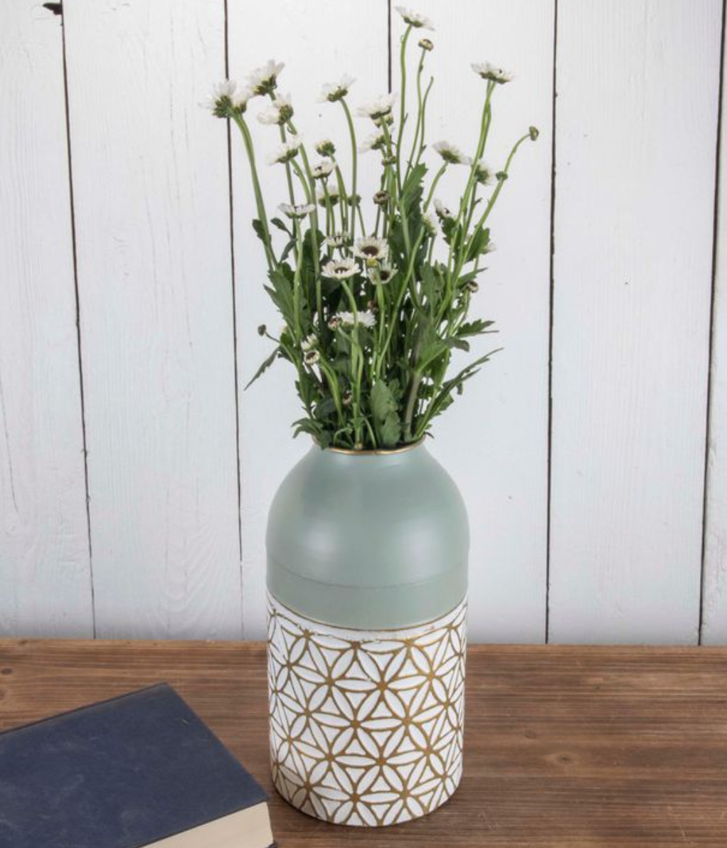 The Marian Brass Vase, with its elegant white and gold floral design, adds a modern touch to any room, elevating your space beautifully