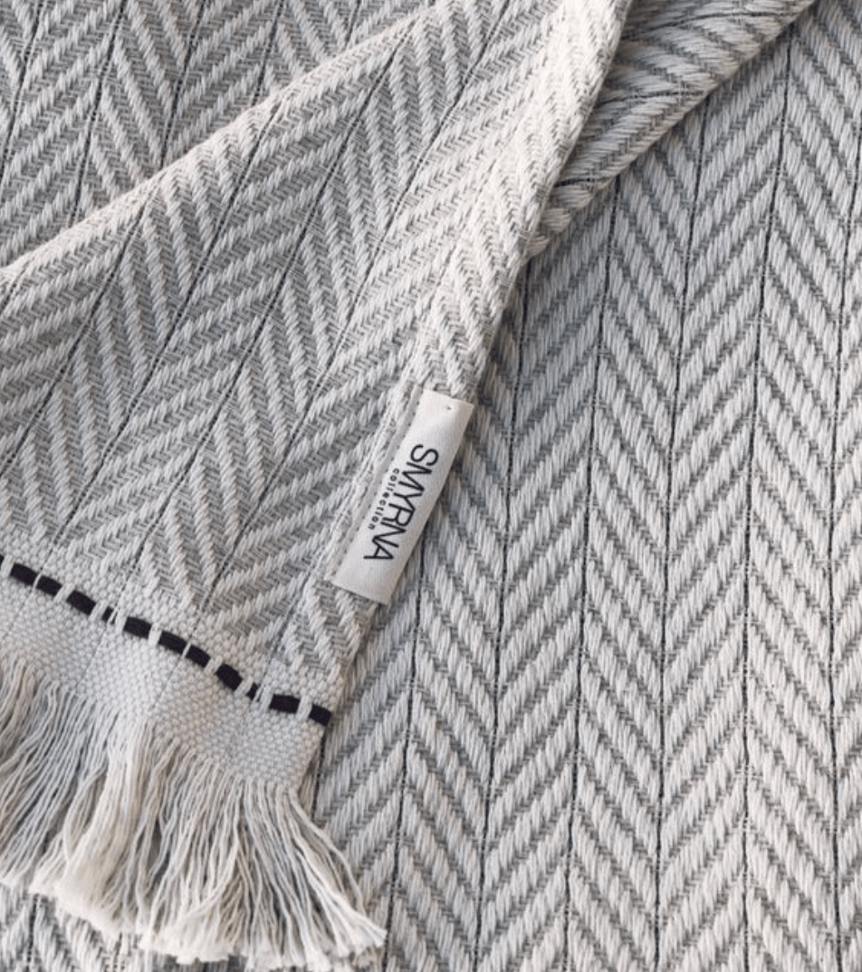 Hand-loomed 100% Turkish cotton Jacqueline Chevron Throw, perfect for adding warmth and style with its chevron pattern and fringe