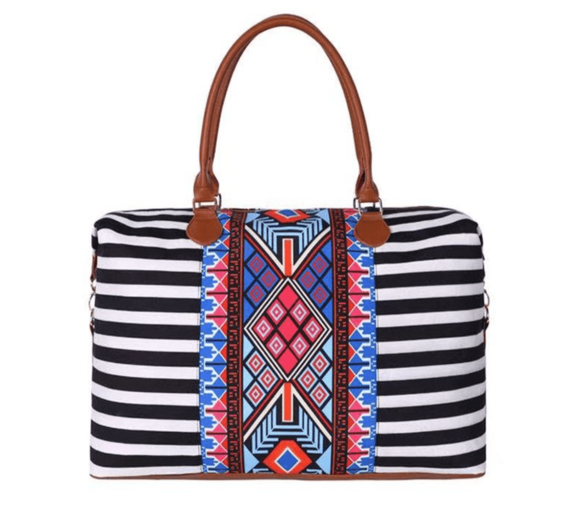 Aztec Weekender Bag with vibrant design, multiple pockets, gold hardware, and cognac straps, perfect for trips.