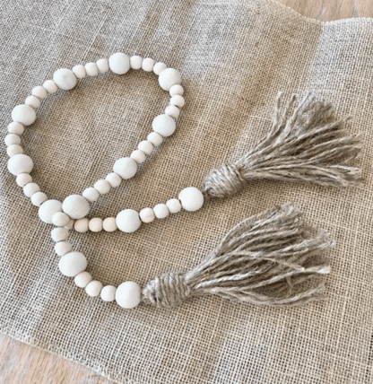 Cream-colored Zoe Beaded Garland – a beautiful accent piece with hand-painted wood beads, ideal for gifting or home decoration