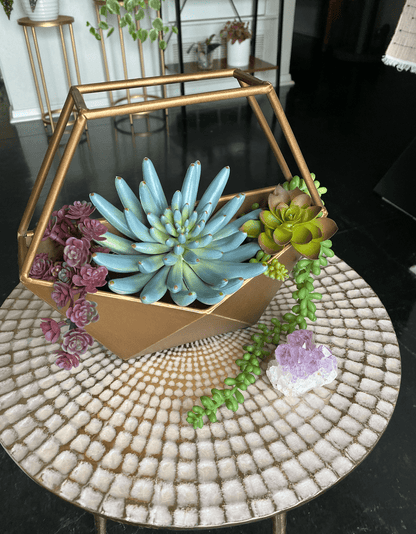 gemma bronze planter, geometric design with metal base and open top, can be used as a wall-hanging or freestanding planter for any space