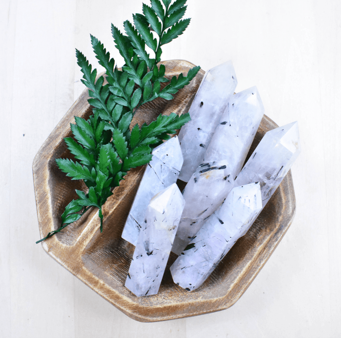 Grouped Tourmaline in Quartz Points offer protection and amplified energy, perfect for shielding against negativity and spiritual practice