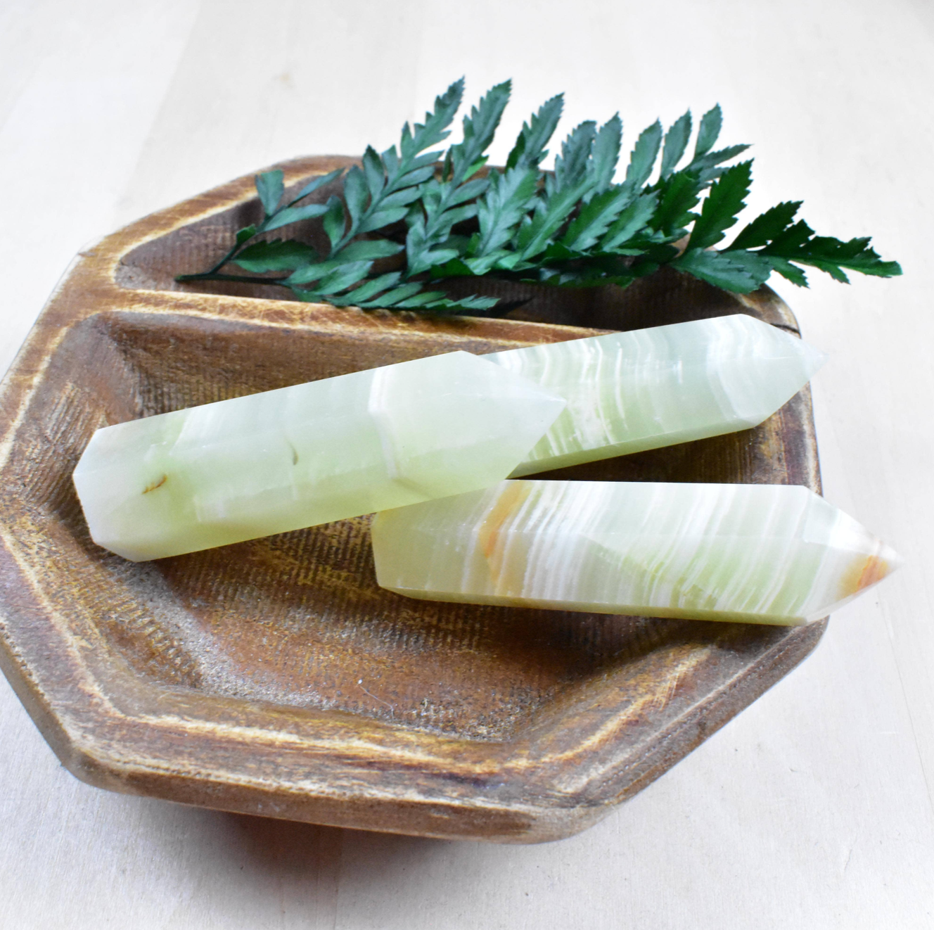 Green Afghan Jade Point: Healing gemstone with swirling greens, known for heart chakra alignment and shielding from negative energy