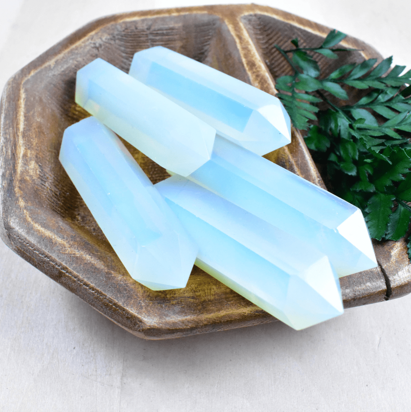 Embrace change with the Opalite Point, offering soothing energy and a soft iridescent glow, ideal for fostering tranquility and balance