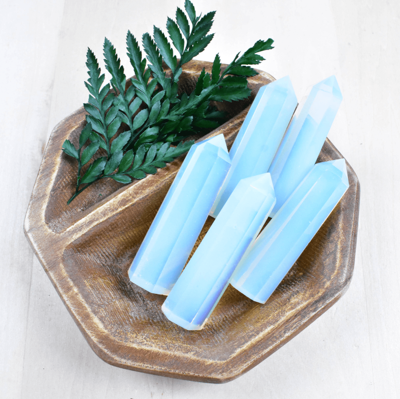 Opalite Point, a calming and visually stunning crystal, enhances emotional balance and guides you through transitions with peaceful energy