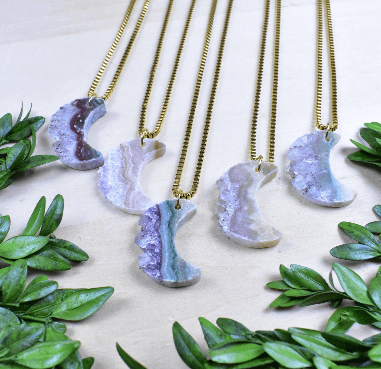 Natural Amethyst crescent moon necklace with a gold-plated chain, ideal for everyday wear and spiritual balance.