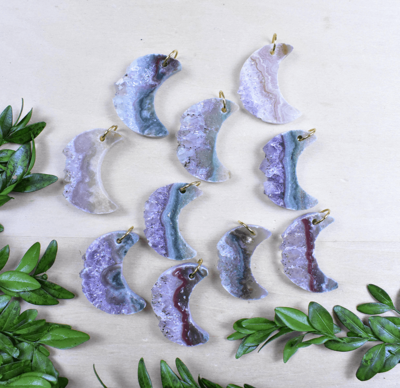 Group of Amethyst crescent moon necklaces with gold-plated chains, perfect for gifts or self-care.