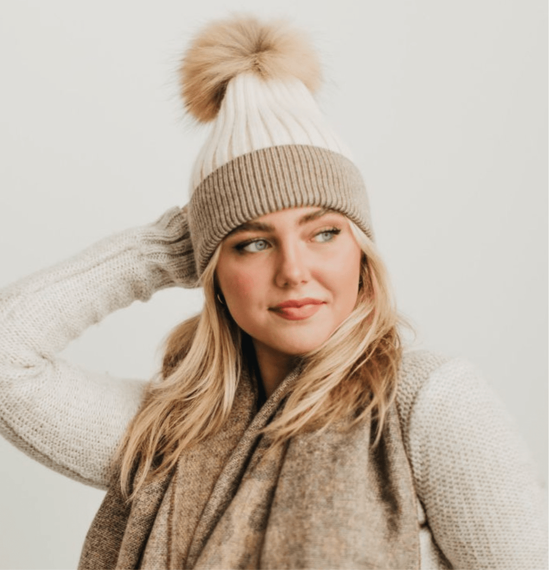 Two-tone Angora fur pom beanie, made from soft Angora material with ethically sourced raccoon fur pom.