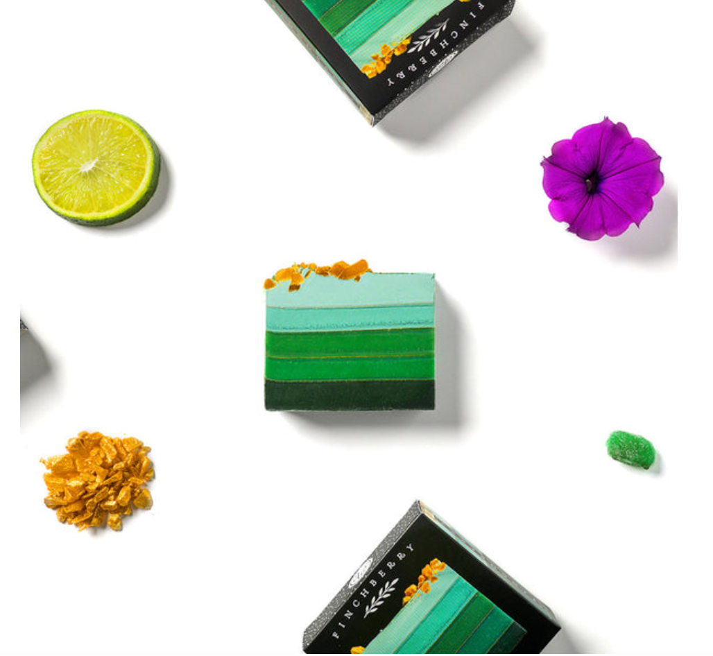 emerald vegan soap, infused with citrus and violet scents, crafted with organic oils and shea butter for a refreshing, nourishing cleanse