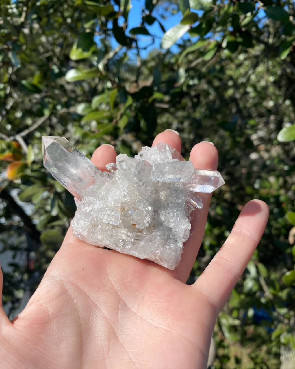 Clear Quartz Cluster with multiple crystal points, harmonizing energy to create a vibrant, positive atmosphere in any room