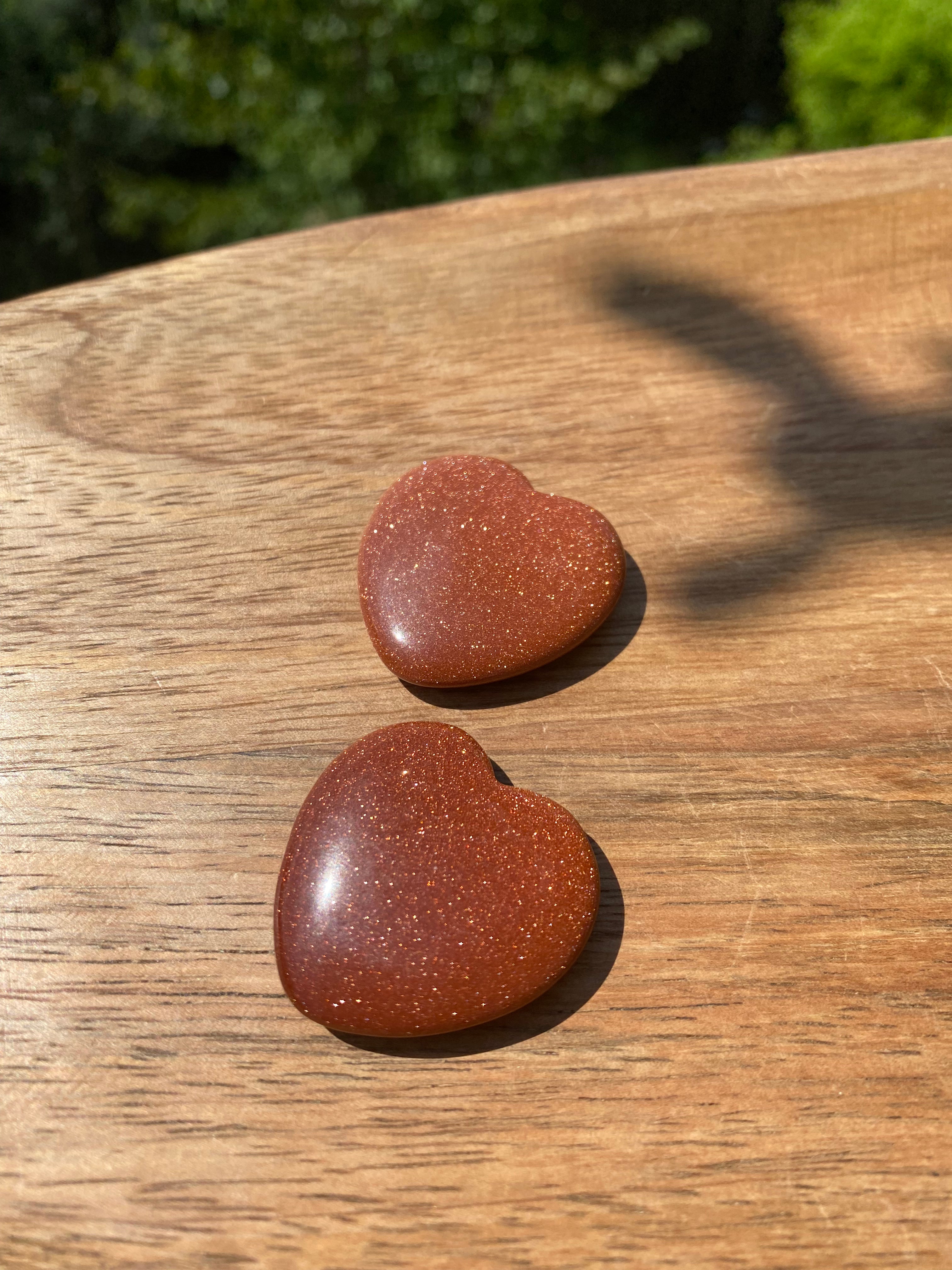 Goldstone carved heart, promotes motivation and positivity, encourages success with its uplifting, shimmering energy