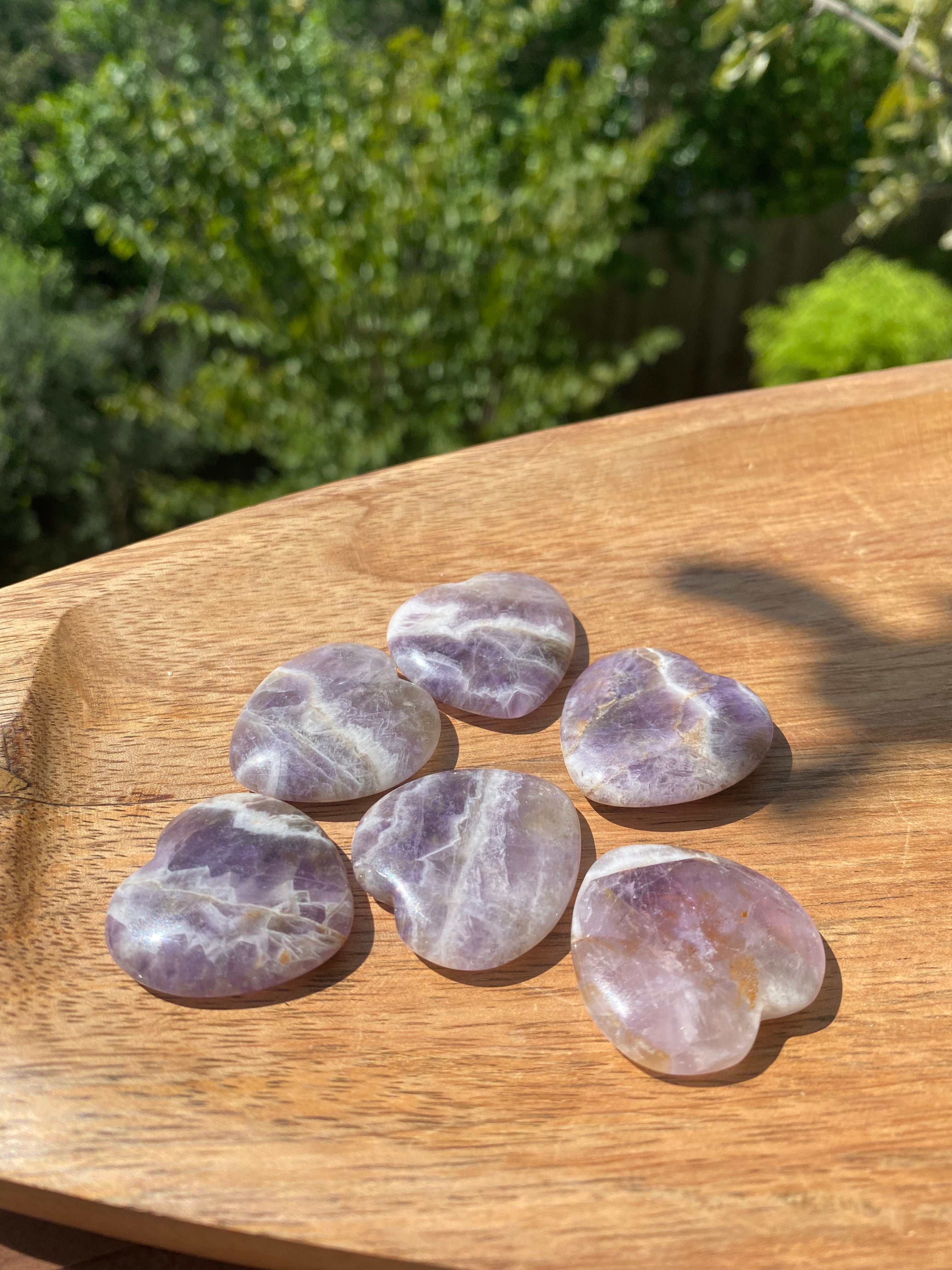 Amethyst carved heart, helps soothe irritability and dispel fear, known for its healing powers and activation of the crown chakra