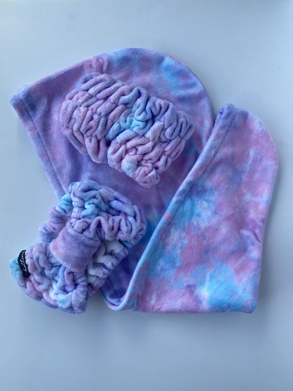 Soft and plush purple tie-dye Stella Spa Headband, ideal for a spa-like experience, providing comfort during your skincare rituals