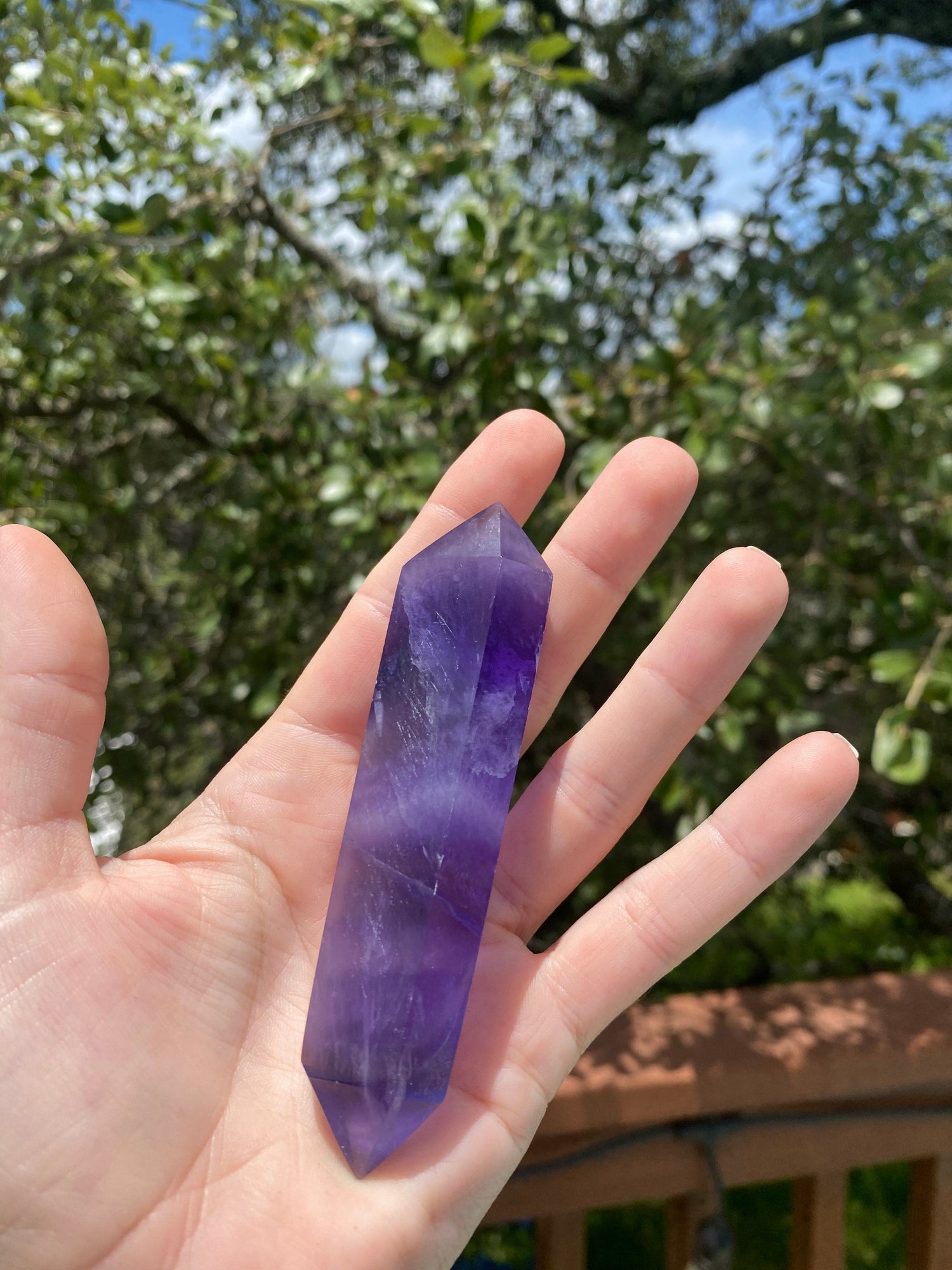 double-terminated fluorite crystal, transforms negative energy into positive, boosting mental clarity and promoting peace of mind