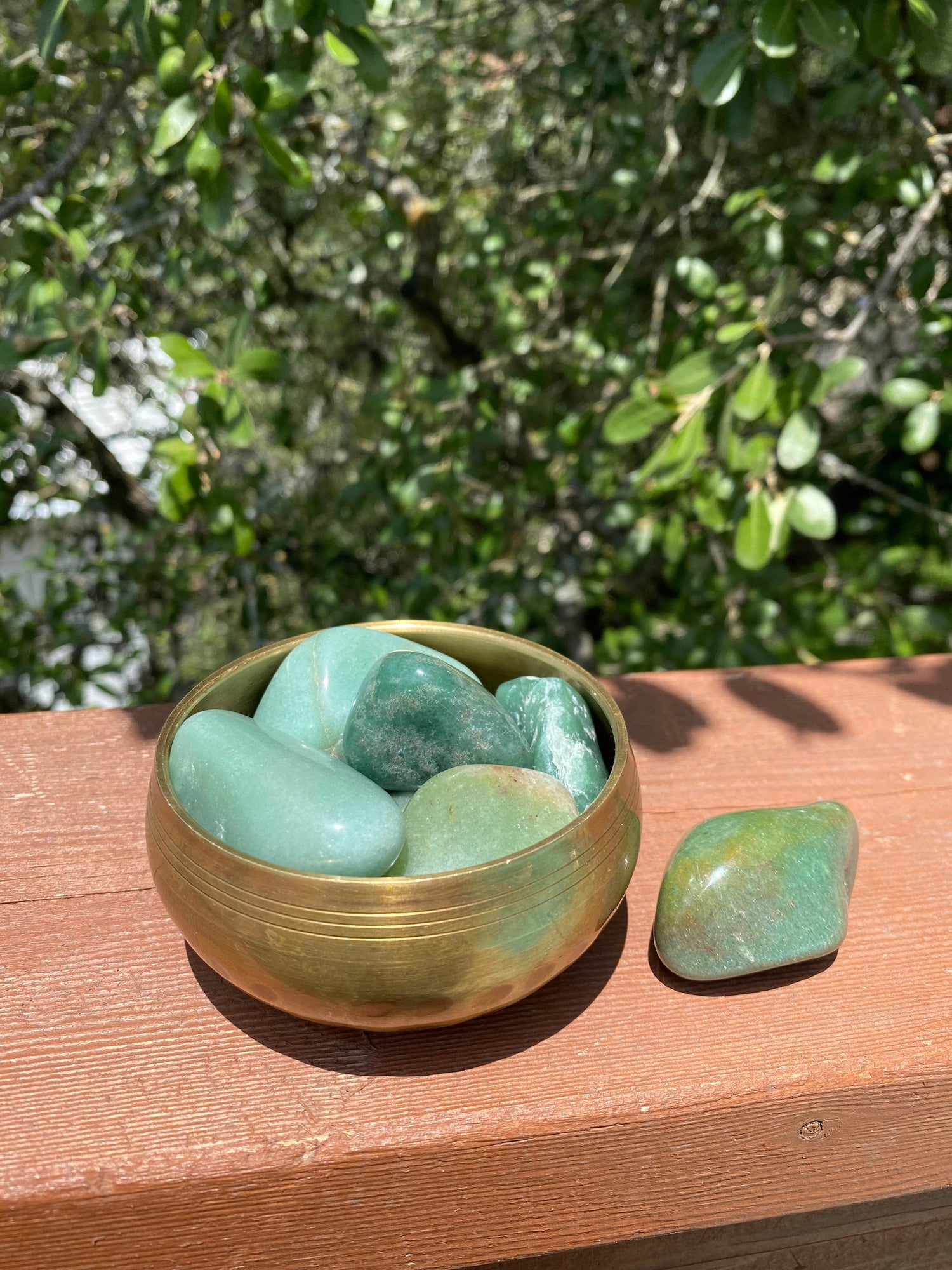 Group of Green Aventurine tumble stones placed in a decorative bowl, perfect for enhancing luck, courage, and positive energy in any space