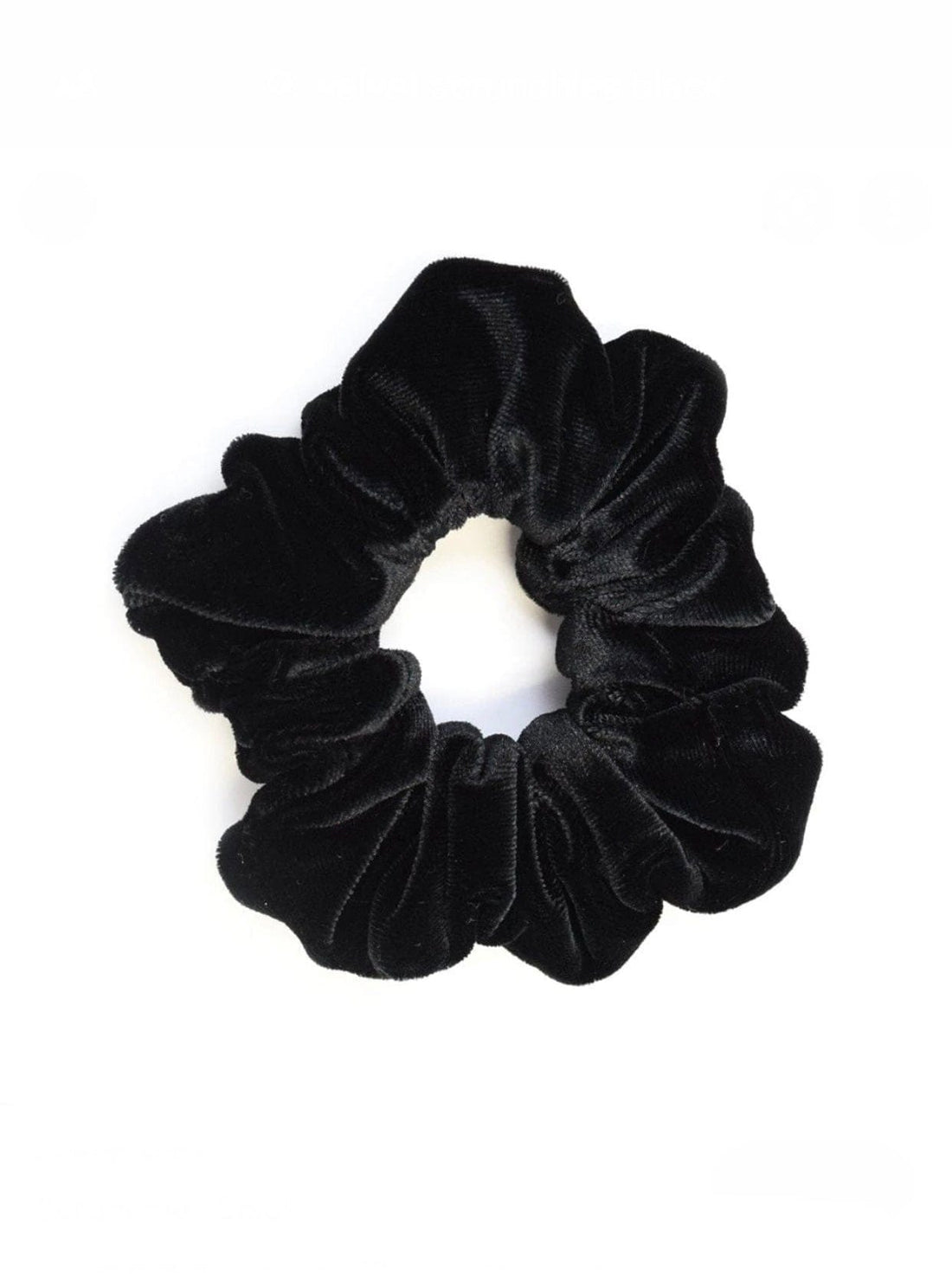 Rochelle Black Velvet Scrunchie offers a secure hold with soft velvet material, perfect for styling a comfortable, chic messy bun